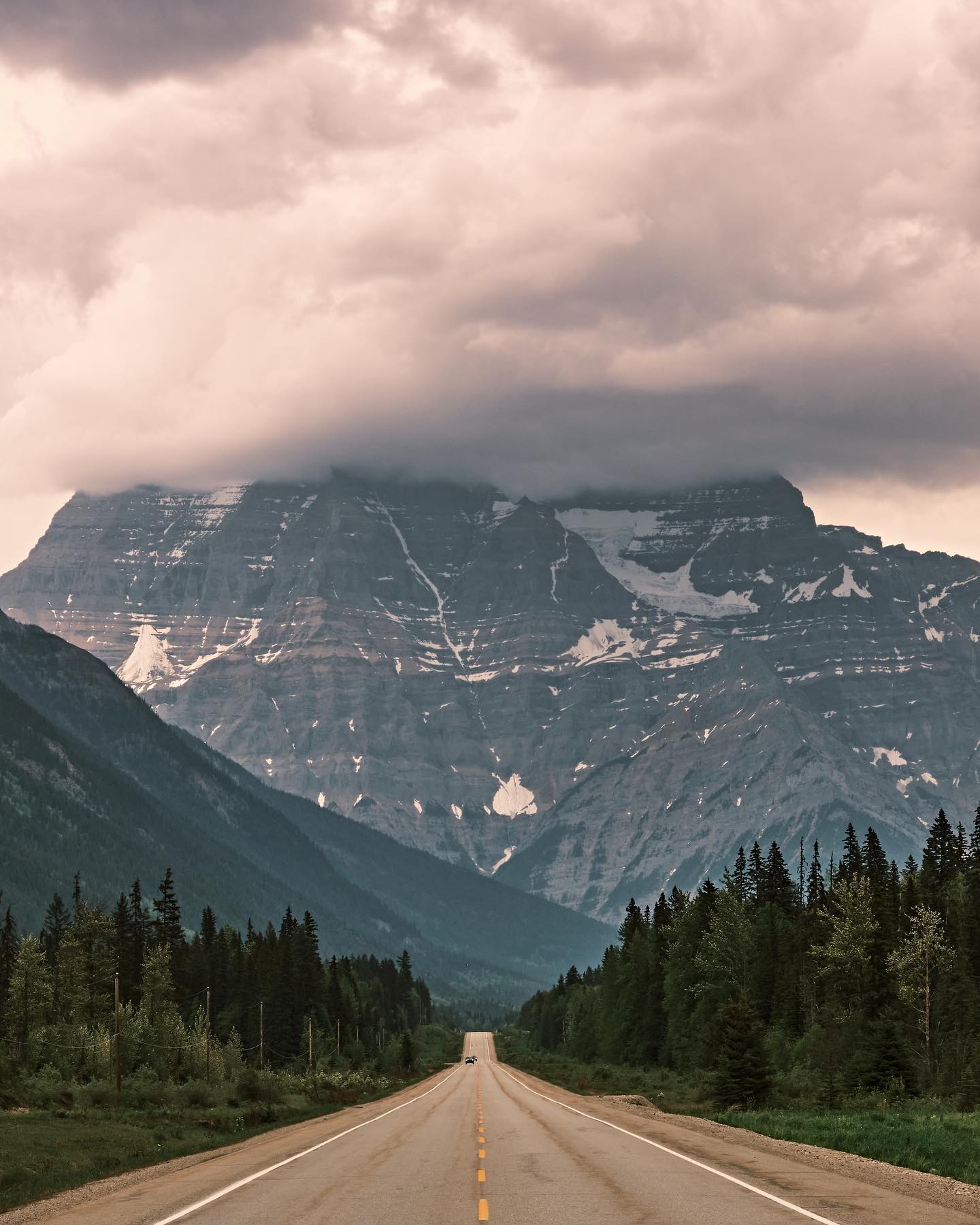 photo by pics_by_reece caption reads: • Canadian Pavement • 

One of the highlights of Canada’s highways is driving through the Rockies. The mountain featured in this photo is Mount Robson and being one of the most prominent mountains in the range, it is jaw dropping. 

Shot on fujifilmx_ca XT4 and fujinonlenses 18-55mm f/2.8-4.0 
• 1/220s • f/16 • ISO 800 • 
Edited with captureonepro 

#hellobc #bcparks #editwithus #explorecanada #canadatravel #canadavisuals #exploretocreate #getoutside #fujifilm_canada #albertabound #mountains #highway #cangeo #cangeotravel #highwayphotography 

hellobc yourbcparks parks fujixlovers fujifilm.focus _fujilove_ explorecanada tourcanada cangeo cangeotravel canadavisuals shotsofcanada